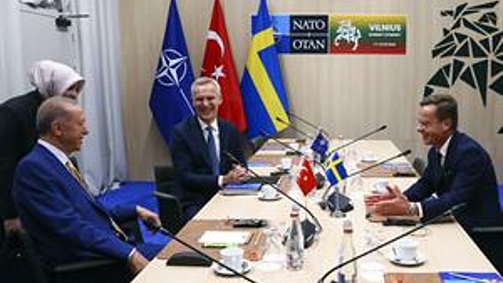 NATO Secretary-General Jens Stoltenberg (C), Turkish President Tayyip Erdogan (L) and Swedish Prime Minister Ulf Kristersson (R) react during a meeting, on the eve of a NATO summit, in Vilnius, Lithuania, 10 July 2023