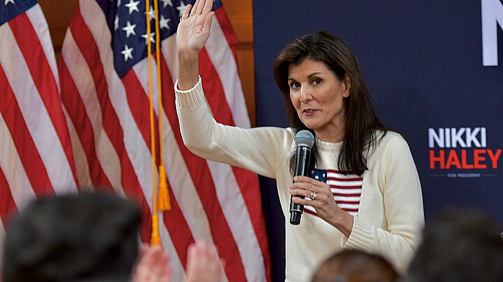 Former U.N. Ambassador Nikki Haley waves to the crowd at a campaign rally during the New Hampshire presidential primary.