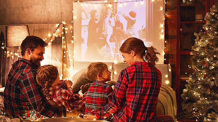 Family enjoying Christmas movies during the holiday seaseon