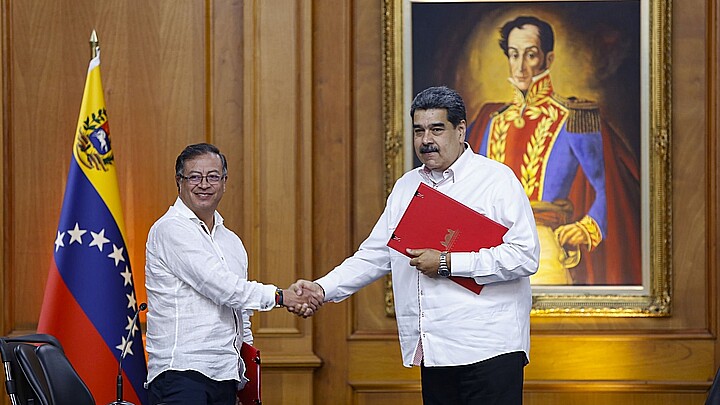 Presidents Nicolas Maduro (R) of Venezuela and Colombia, Gustavo Petro (L) sign an agreement, at the Miraflores Palace, in Caracas, on November 1, 2022