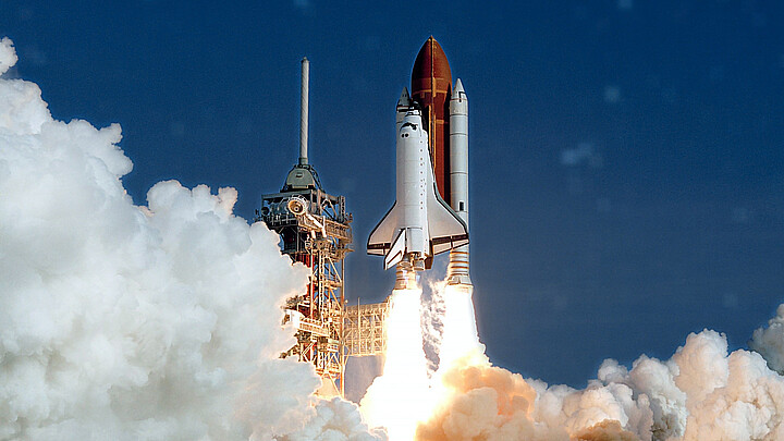 The launch of the NASA Space Shuttle. With fire and smoke. Against the background of the starry sky. Elements of this image were furnished by NASA.