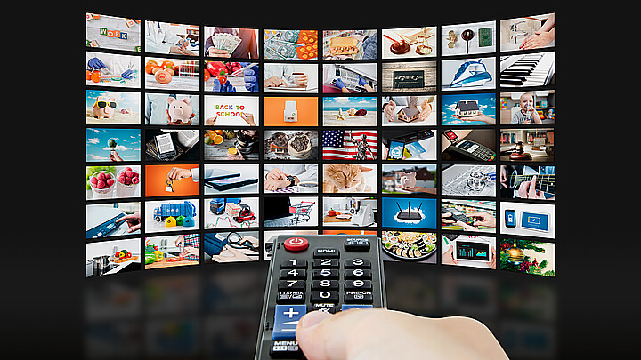 Remote control changing channels on television sets