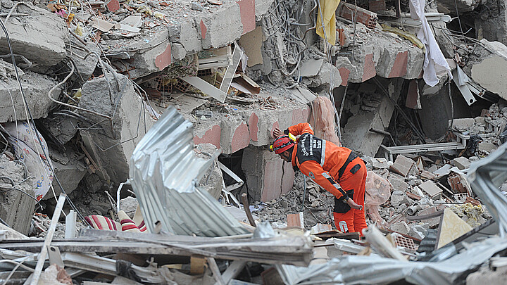 Rescuers looking for survivors under the rubble 