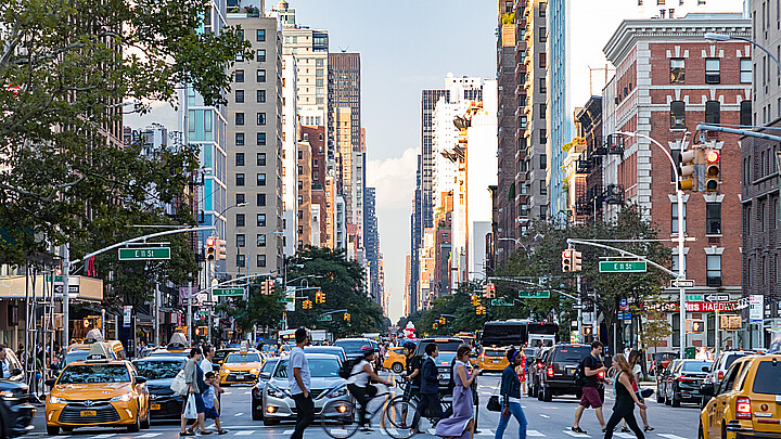 Busy New York City street intersection in the East Village circa 2017