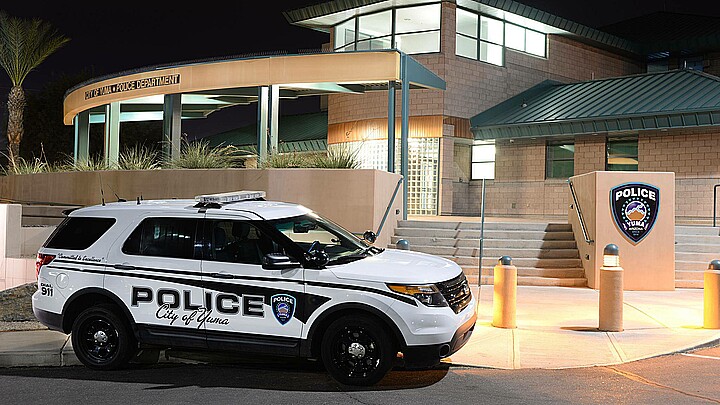 Yuma, Arizona Police Department with police vehicle at night