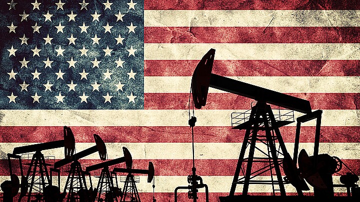 Oil fields with background of the American flag