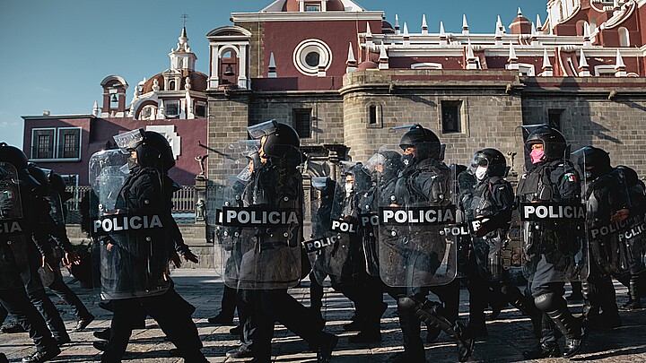 Mexican police officers prepare to patrol in the City of Puebla