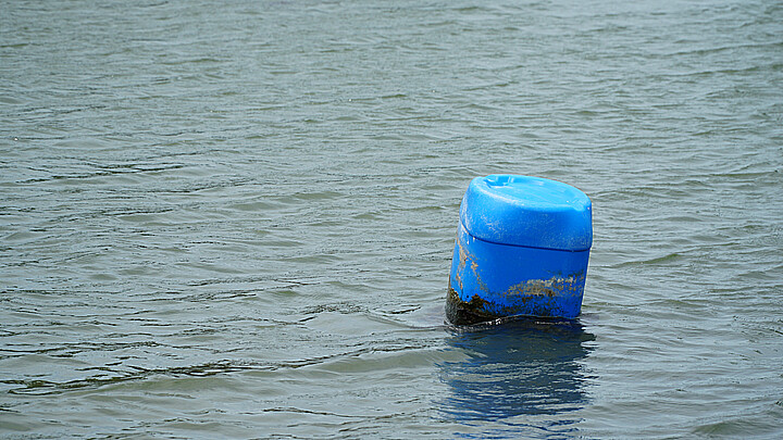 Barrel floating in water
