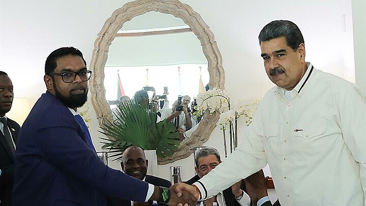 Guyanese President Irfan Ali and Venezuelan dictator Nicolas Maduro shake hands in agreement over contested region