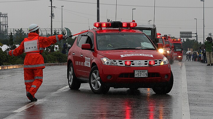 A scene from a disaster prevention drill that assumes a major earthquake held in heavy rain in Tokushima Japan in October 2011