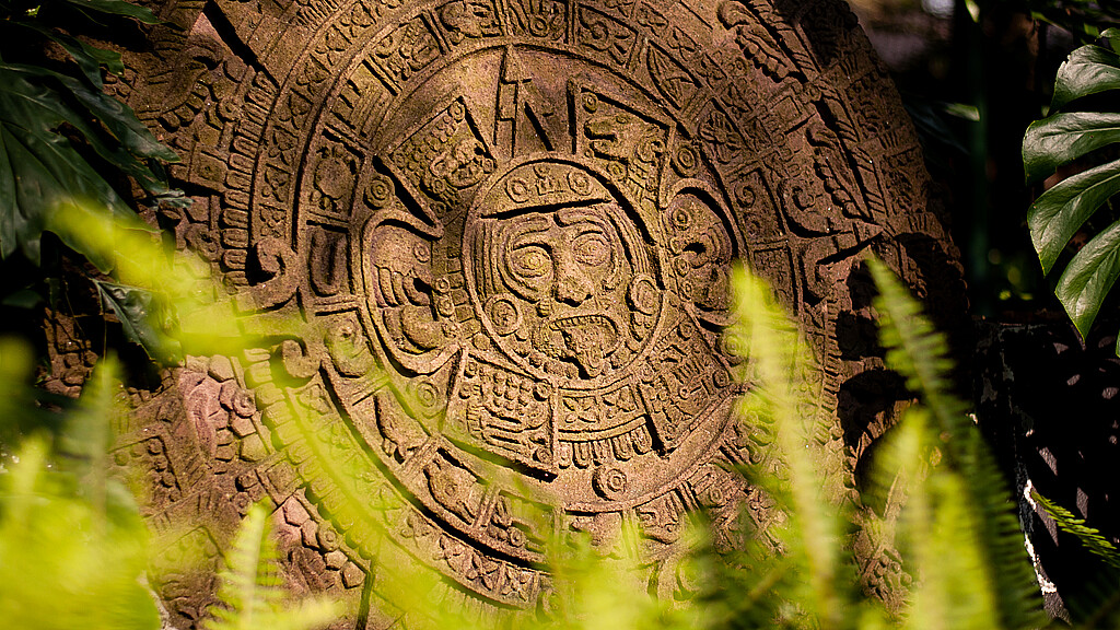 Replica of the Aztec sun stone located at a garden of a cultural center. The sun stone is the most famous work of Aztec sculpture.
