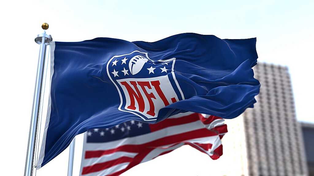 NFL flag waving by the American flag