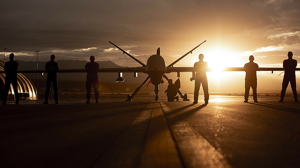432nd Wing/432nd Air Expeditionary Wing Airmen pose with an MQ-9 Reaper for a photo at Creech Air Force Base