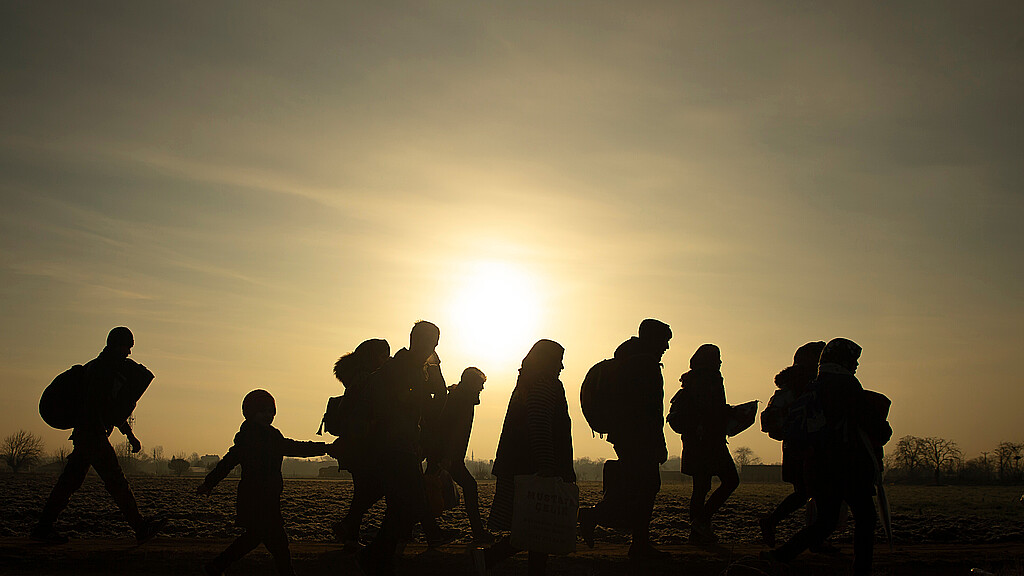 Stock photo of migrants traveling