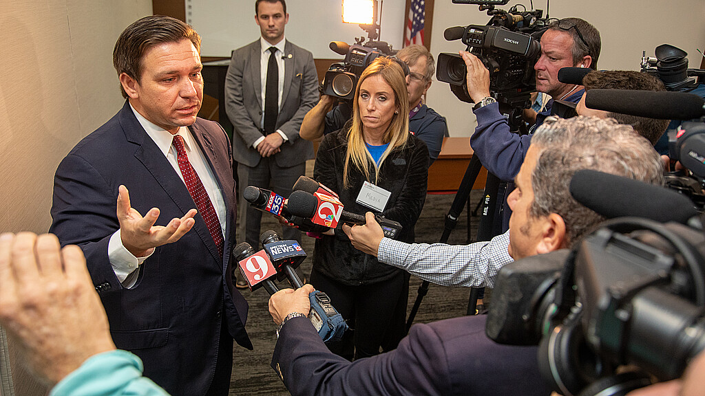 Florida Gov. Ron DeSantis answering questions from press