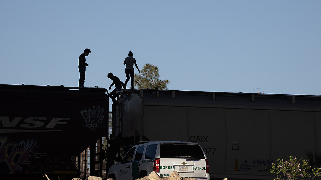 Migrants onboard train at border