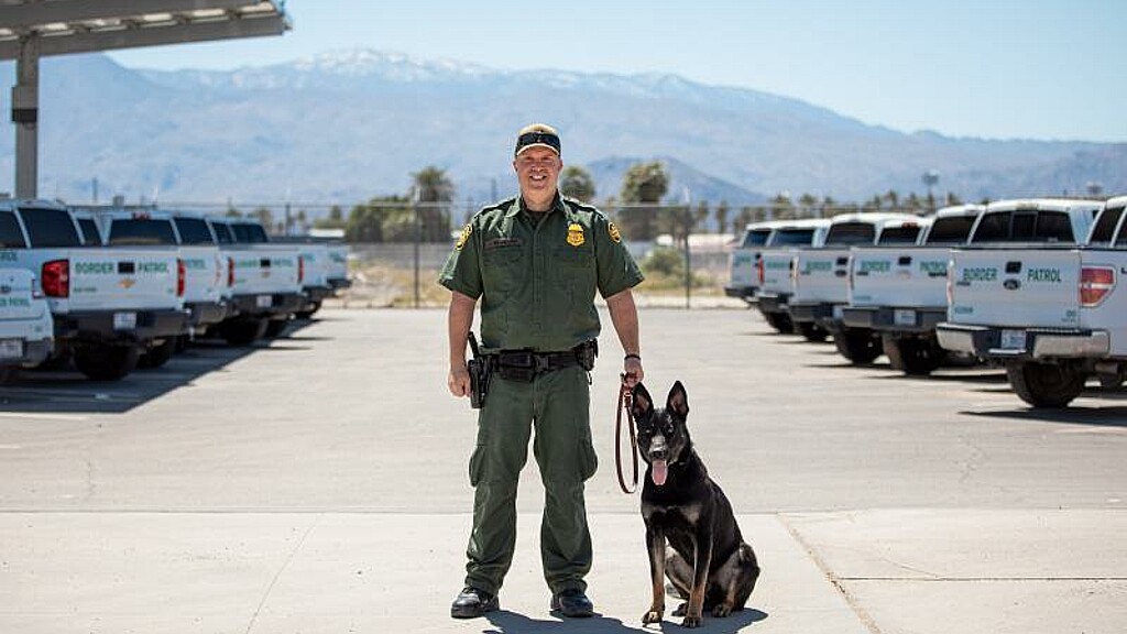 Custom Border Patrol officer in El Centro, California with CBP K-9 officer