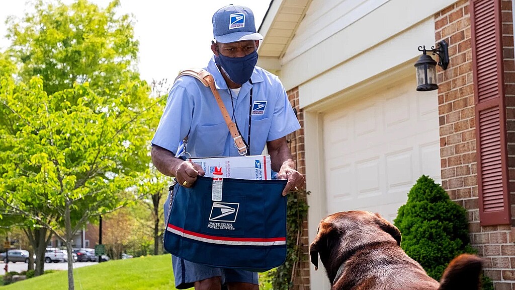 U.S. Postal Service worker faces a dog looking for trouble