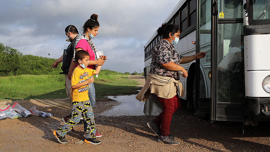 Migrants board a bus in La Joya, Texas