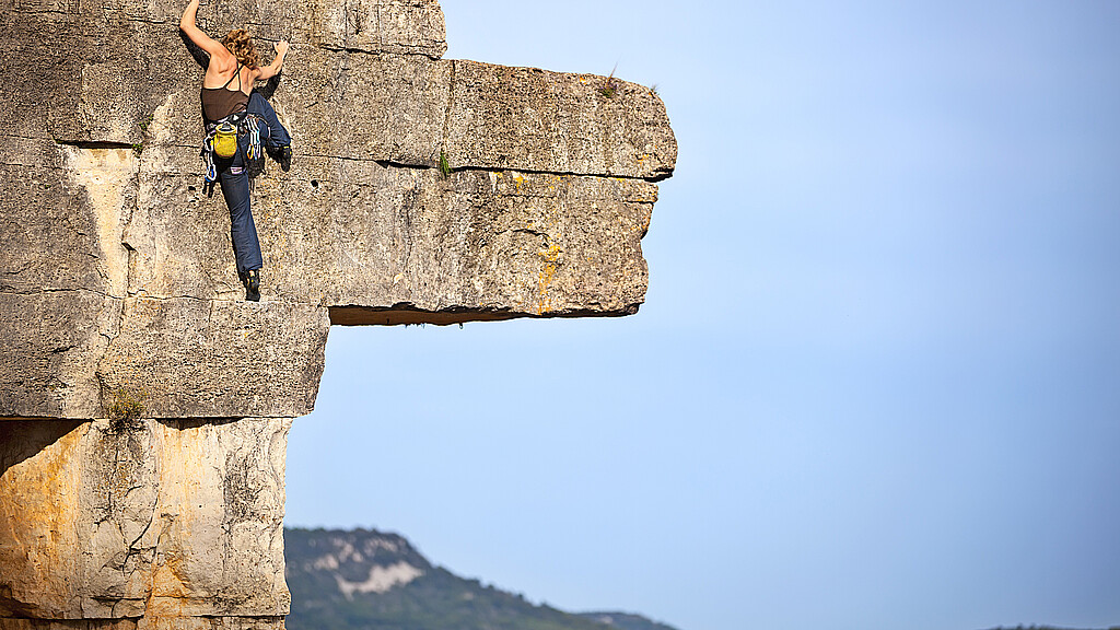 Woman free climbing 