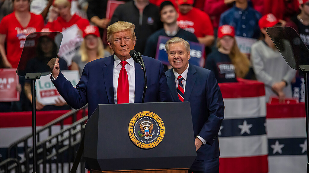 U.S. Sen. Lindsey Graham on stage with President Donald Trump
