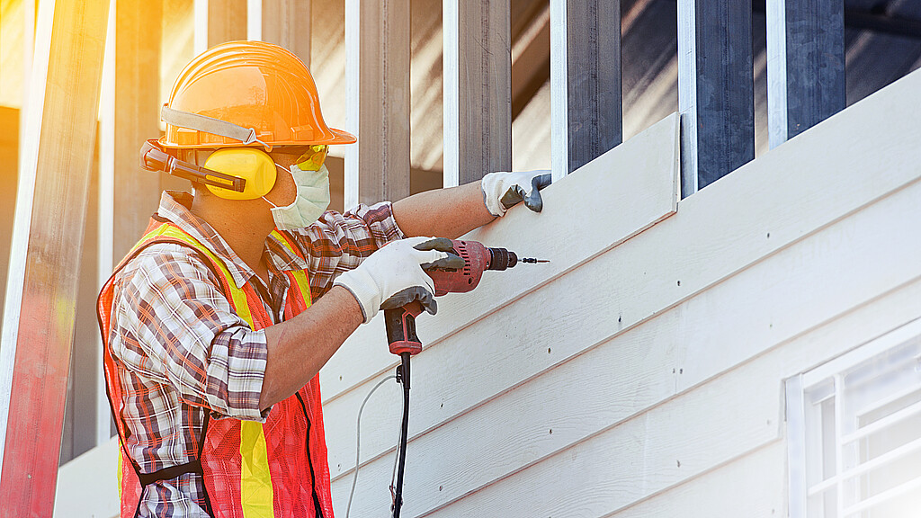 Stock photo of construction worker on new home development