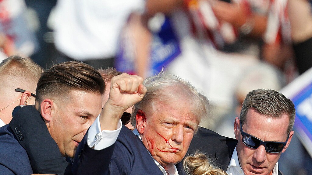 Former US President Donald Trump is rushed off stage by secret service 