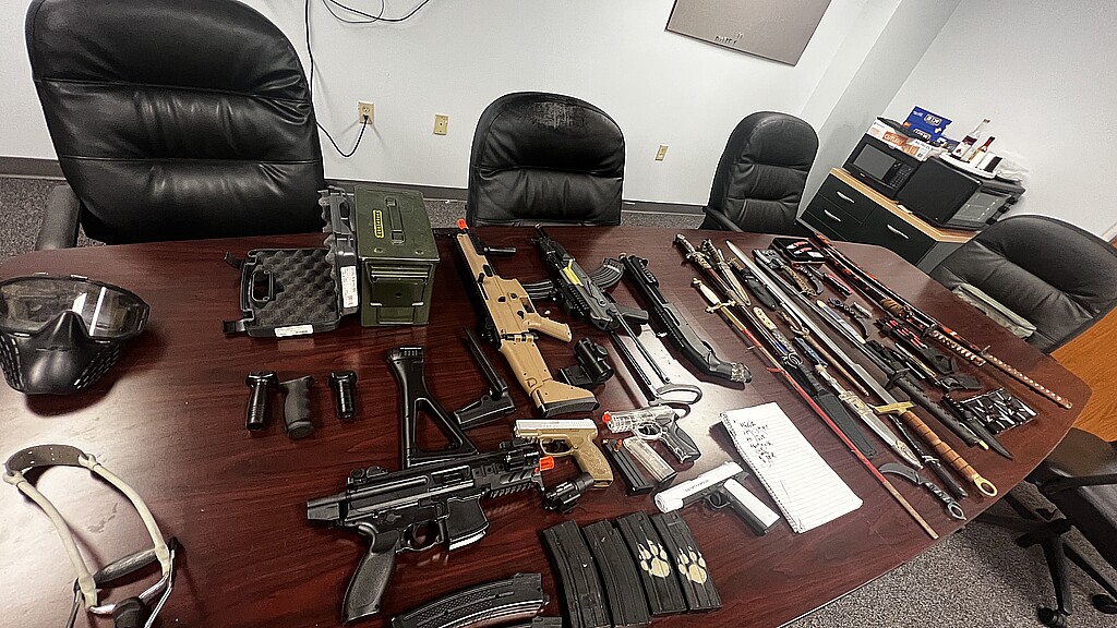 A cache of airsoft guns, fake ammunition, knives, swords and other weapons found at the teen's residence