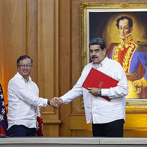 Presidents Nicolas Maduro (R) of Venezuela and Colombia, Gustavo Petro (L) sign an agreement, at the Miraflores Palace, in Caracas, on November 1, 2022