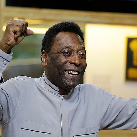 Former soccer great Edson Arantes do Nascimento, known as Pele, pose for photos during the inauguration of the Pele Museum
