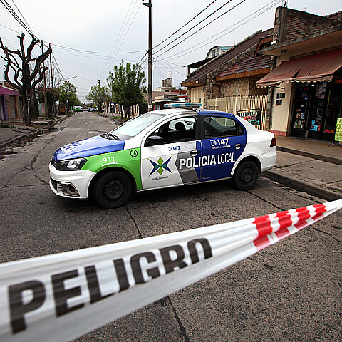 Crime scene tape and police car of Buenos Aires police
