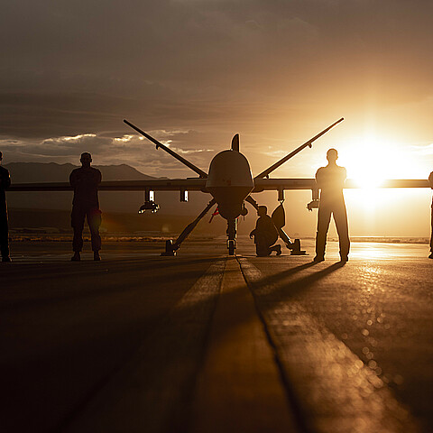 432nd Wing/432nd Air Expeditionary Wing Airmen pose with an MQ-9 Reaper for a photo at Creech Air Force Base