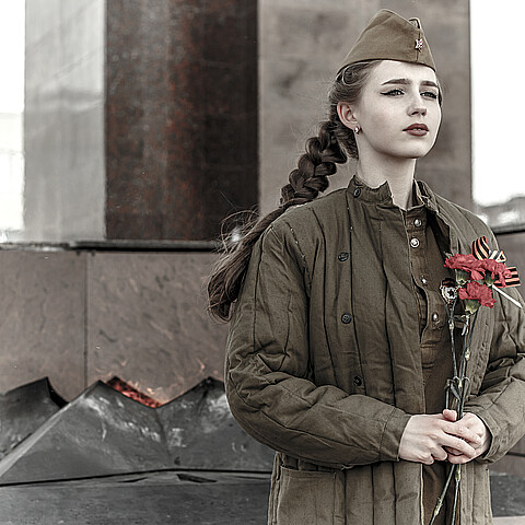 Stock image of pretty young girl in a Soviet military uniform