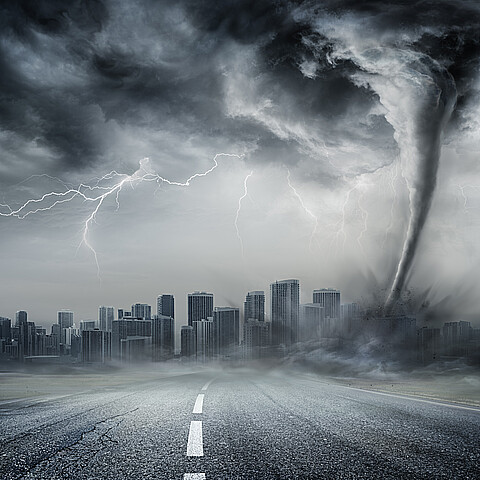 Stock photo image of tornado with city in background