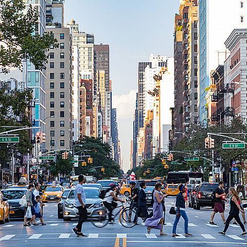 Busy New York City street intersection in the East Village circa 2017