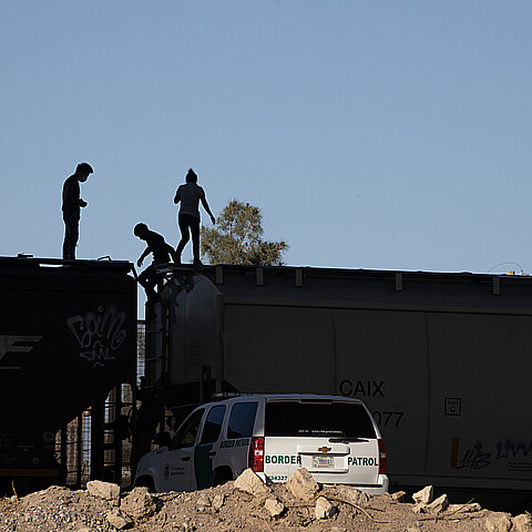 Migrants onboard train at border