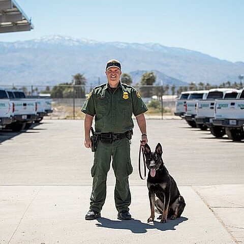 Custom Border Patrol officer in El Centro, California with CBP K-9 officer