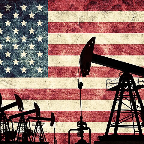 Oil fields with background of the American flag