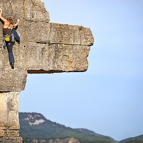 Woman free climbing 