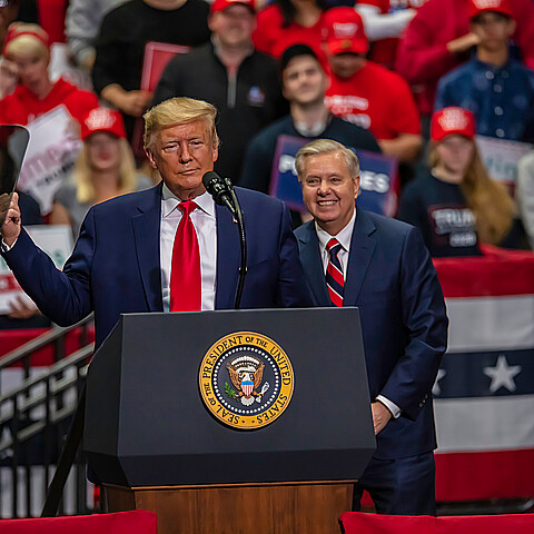 U.S. Sen. Lindsey Graham on stage with President Donald Trump