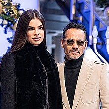Nadia Ferreira and Marc Anthony pose on grand staircase during visit to Empire State Building in New York 