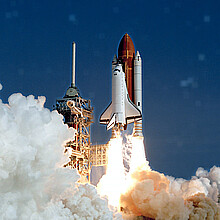 The launch of the NASA Space Shuttle. With fire and smoke. Against the background of the starry sky. Elements of this image were furnished by NASA.