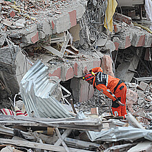 Rescuers looking for survivors under the rubble 