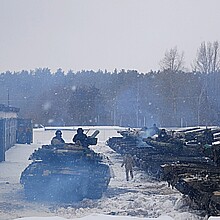Tanks with tankers turn around and go to the training ground