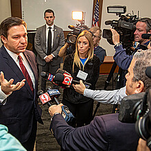 Florida Gov. Ron DeSantis answering questions from press