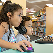 To illustrate: An elder sister assists her brother at library.