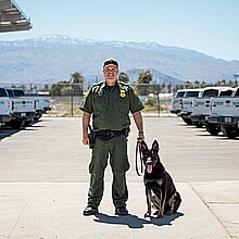 Custom Border Patrol officer in El Centro, California with CBP K-9 officer