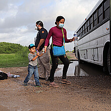  Migrants boarding bus in Texas