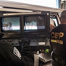 Border Patrol officers use X-Ray scanner machine at crossing point