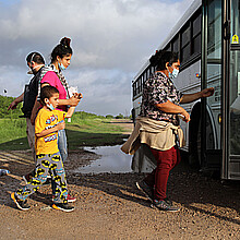 Migrants board a bus in La Joya, Texas